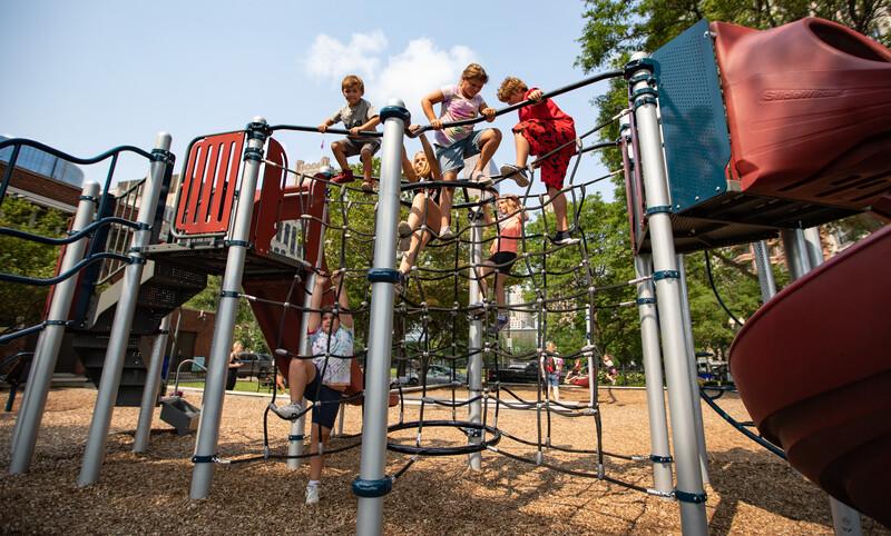 Kids climbing on fish net climber at Lake Shore Park