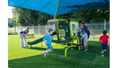Blue & green playsmart play structure being surrounded by kids from Smart Start Childcare Center.
