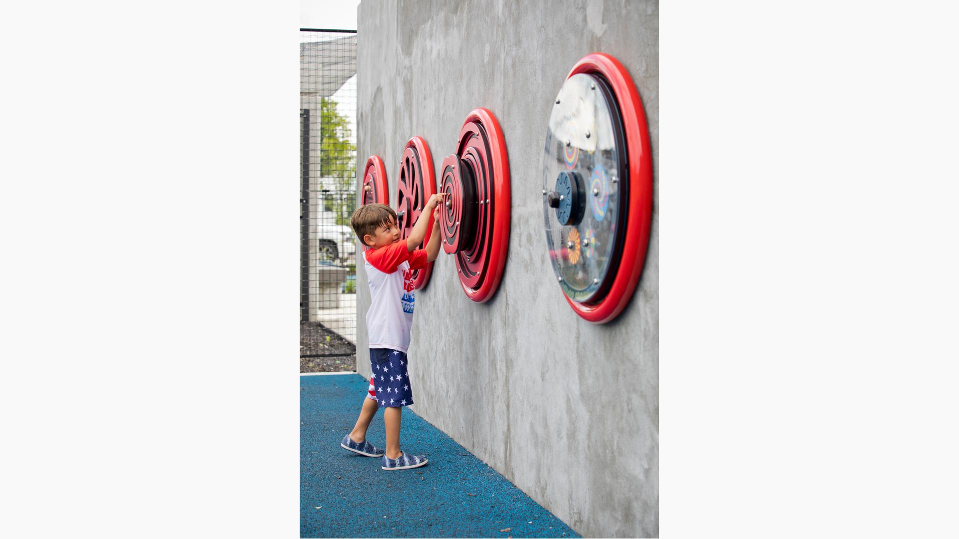 Boy plays with wheel
