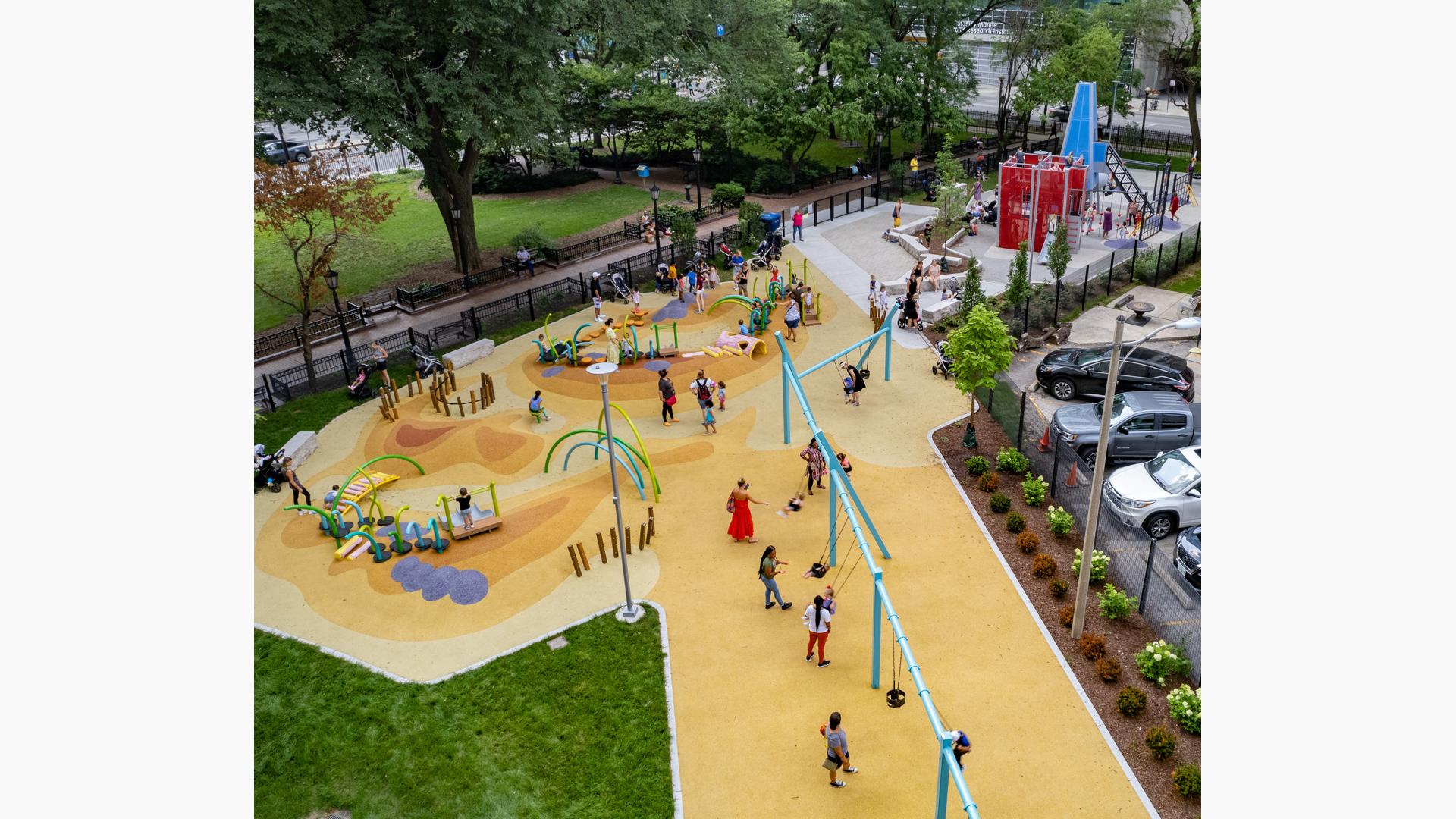 Aerial of families playing at Seneca Park, Eli M. Schulman Playground