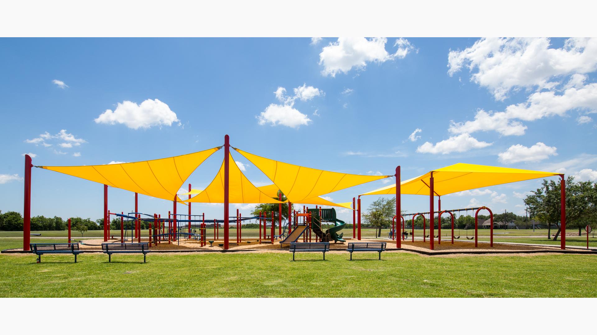 Holly Bay Park in Pasadena, TX houses PlayBooster® playstructure, OmniSpin® Spinner and ZipKrooz® and is nestled under SkyWays® Shade products.