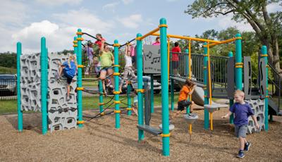 Chilren playing on main play structure of Baden Academy Charter School playground