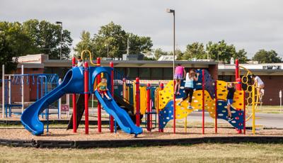 Children playing on the playground at Prairie Queen Elementary.