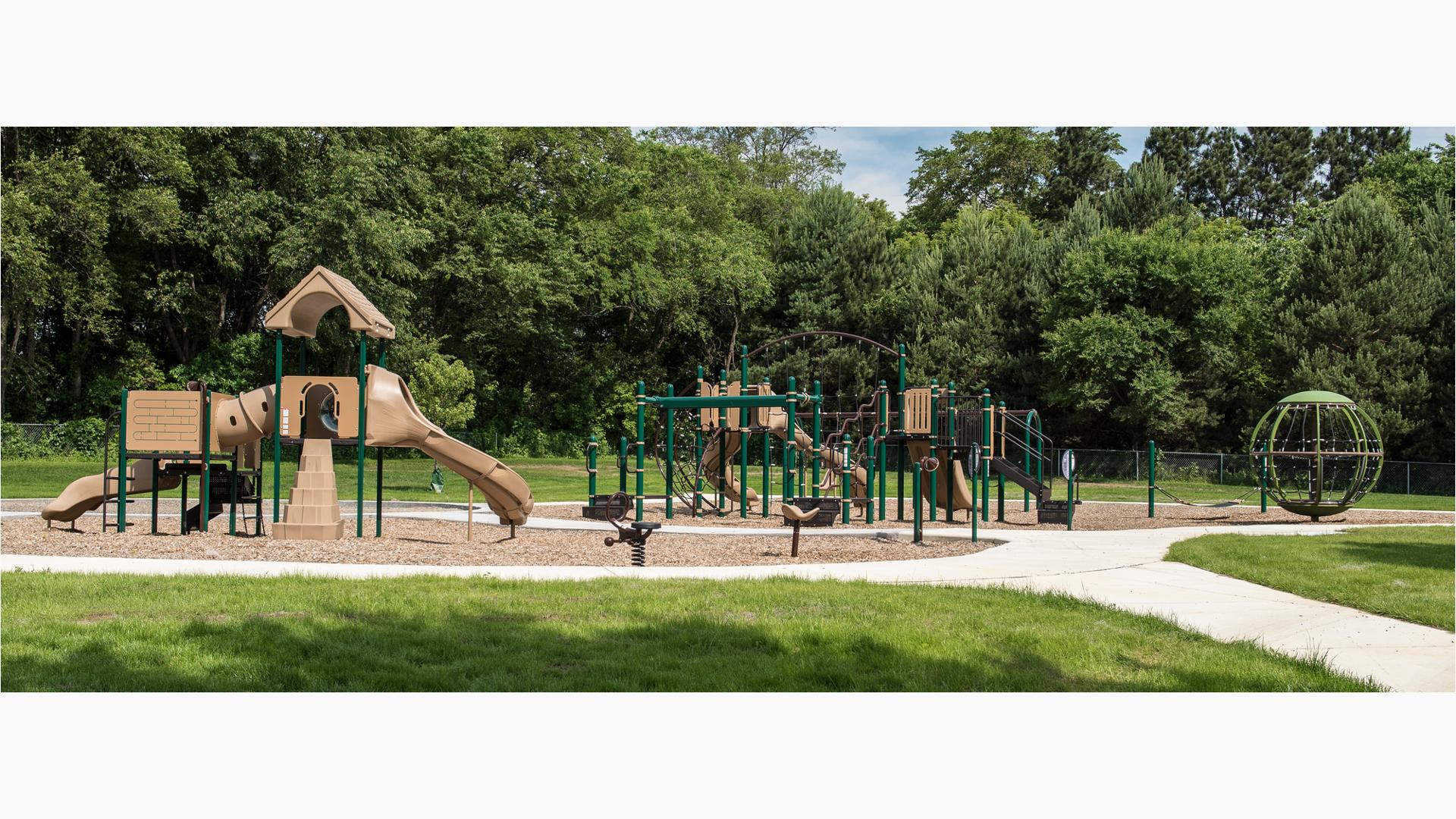 PlayBooster and Playshaper play systems at Shadow Woods Park. Freestanding Global Motin and other are present on the playground.
