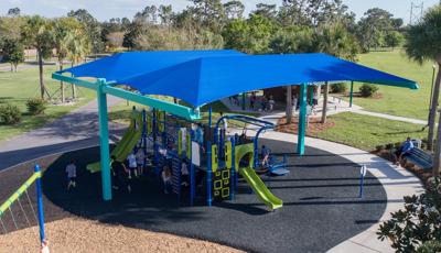 Under SkyWays shade canopies, run around this Smart Play  play structure.