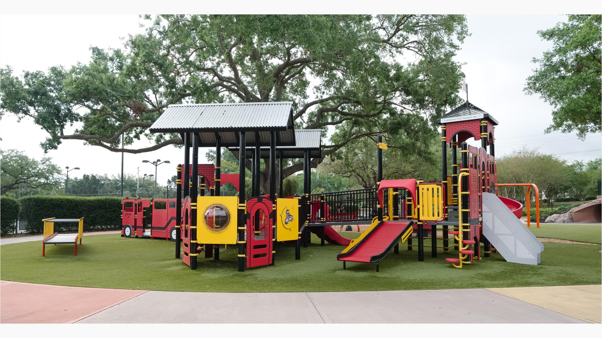 View of Roller Table™, Roller Slide, and learning panels of play structures