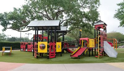 View of Roller Table™, Roller Slide, and learning panels of play structures