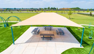 Picnic tables under SkyWays® shade at Lucile Ellingwood Morrow Elementary playground
