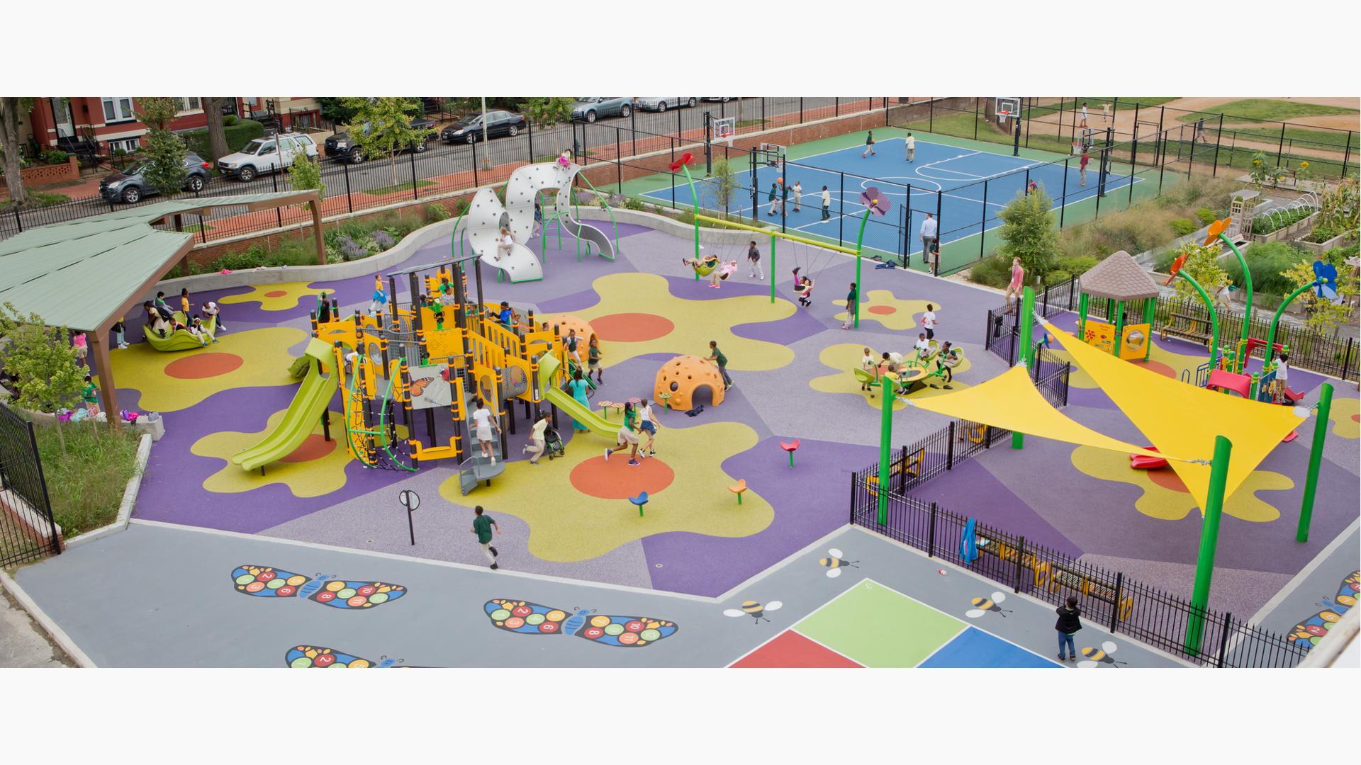 Ludlow Taylor Elementary School Washington, DC. A garden-themed playground features Two PlayBooster® playstructures for ages 2 to 5 and 5 to 12, DigiFuse®, Permalene®. Plus, flower-themed pod steppers and post toppers.
