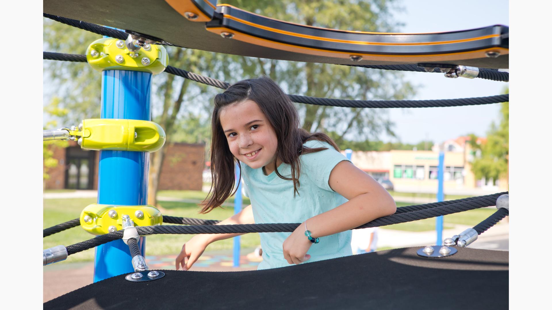 Girl smiling on Netplex® play structure