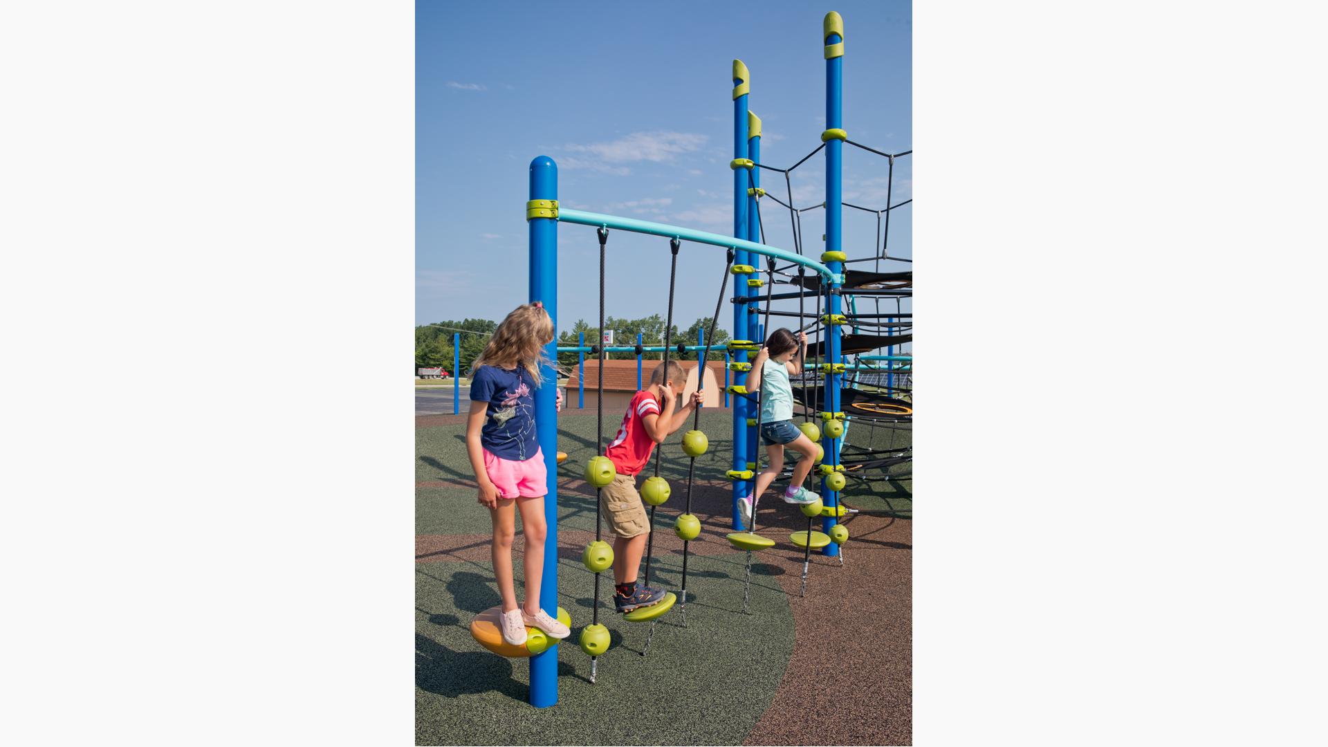 Children playing on SwiggleKnots™ Bridge