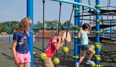 Children playing on SwiggleKnots™ Bridge