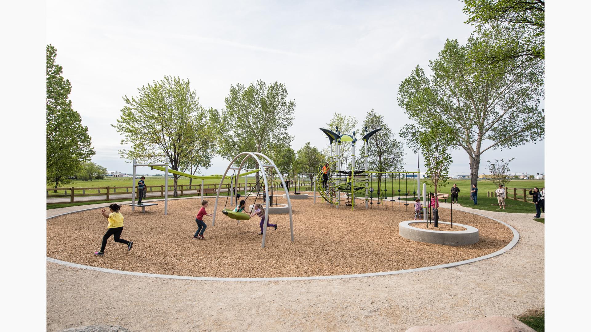 Legion Memorial Park, Winnipeg, MB includes a ZipKrooz®, a PlayBooster Netplex® play structure, climbers, slides and other unique play activities.