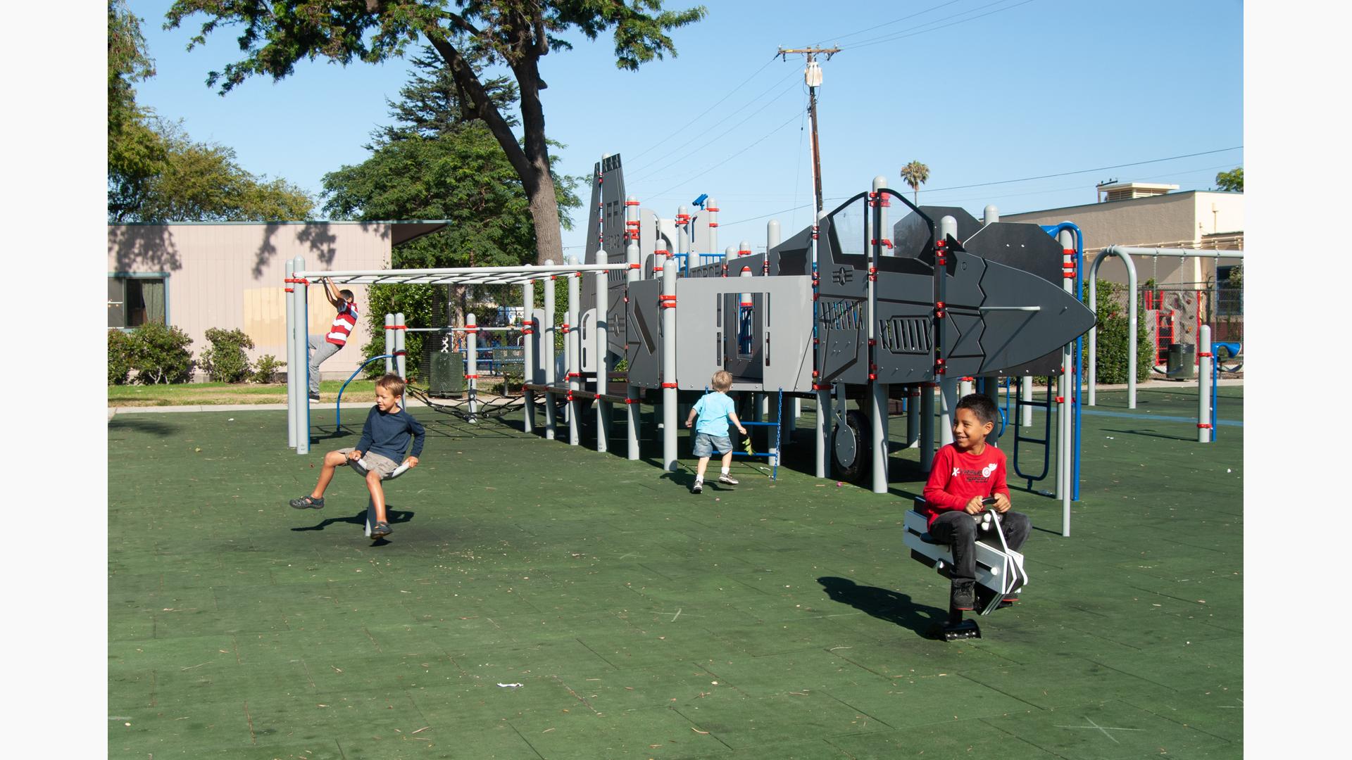 Children playing on custom F-6 at Colonia Park