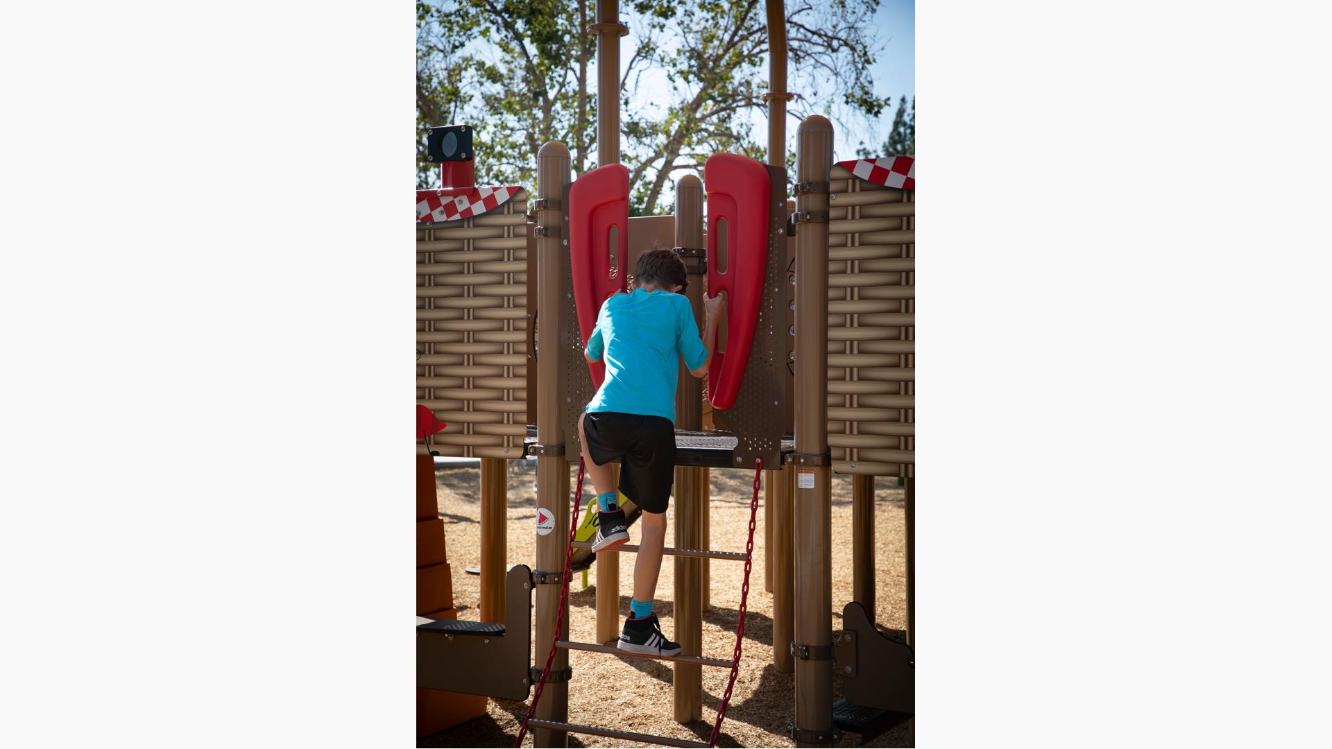 Chain ladder coated in red Tendertuff for temperature-resistant protective coating features red VIbe handholds.