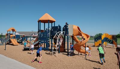Children playing on PlayBooster play structure.