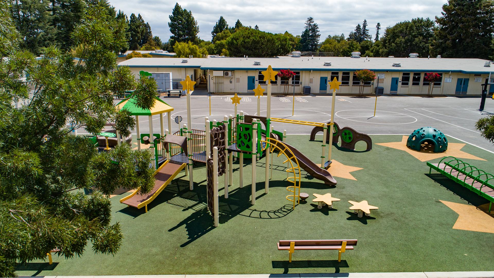View of Ponderosa Elementary playground with school in background