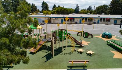 View of Ponderosa Elementary playground with school in background