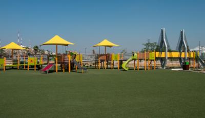 Inclusive playground with lots of ramps and shade with green synthetic surfacing. There is a bridge that is mimic to the famous Baluarte Bridge. 