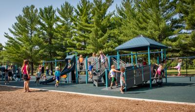 Children playing on PlayShaper® playstructure