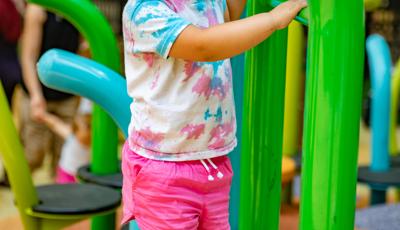 Little girl playing near Noodle Pod® Step