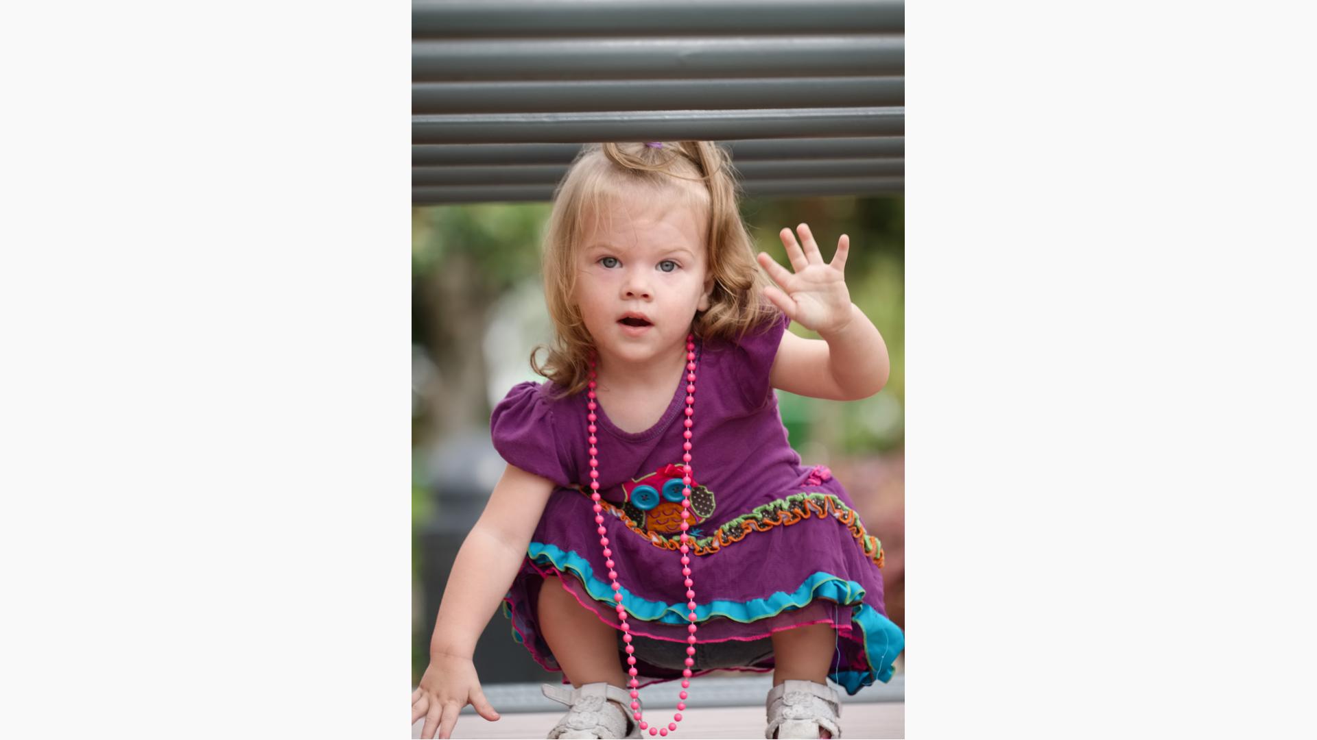 Toddler girl in purple dress