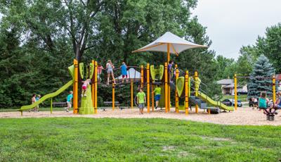 Nadeau Wildlife Area Little Canada, MN. A PlayBooster® play structure featuring  playground climbers and slides, swings, spinners and Bobble Riders®.