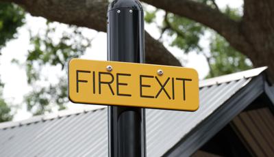 Detail of custom "Fire Exit" signage for play structure.