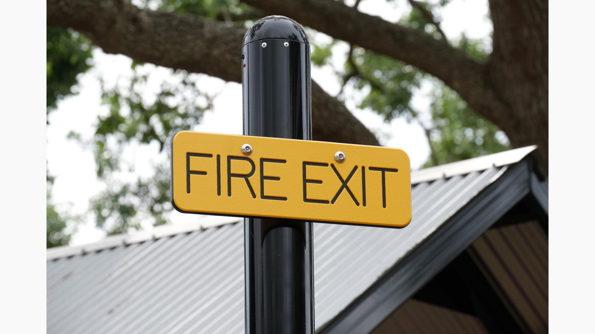 Detail of custom "Fire Exit" signage for play structure.