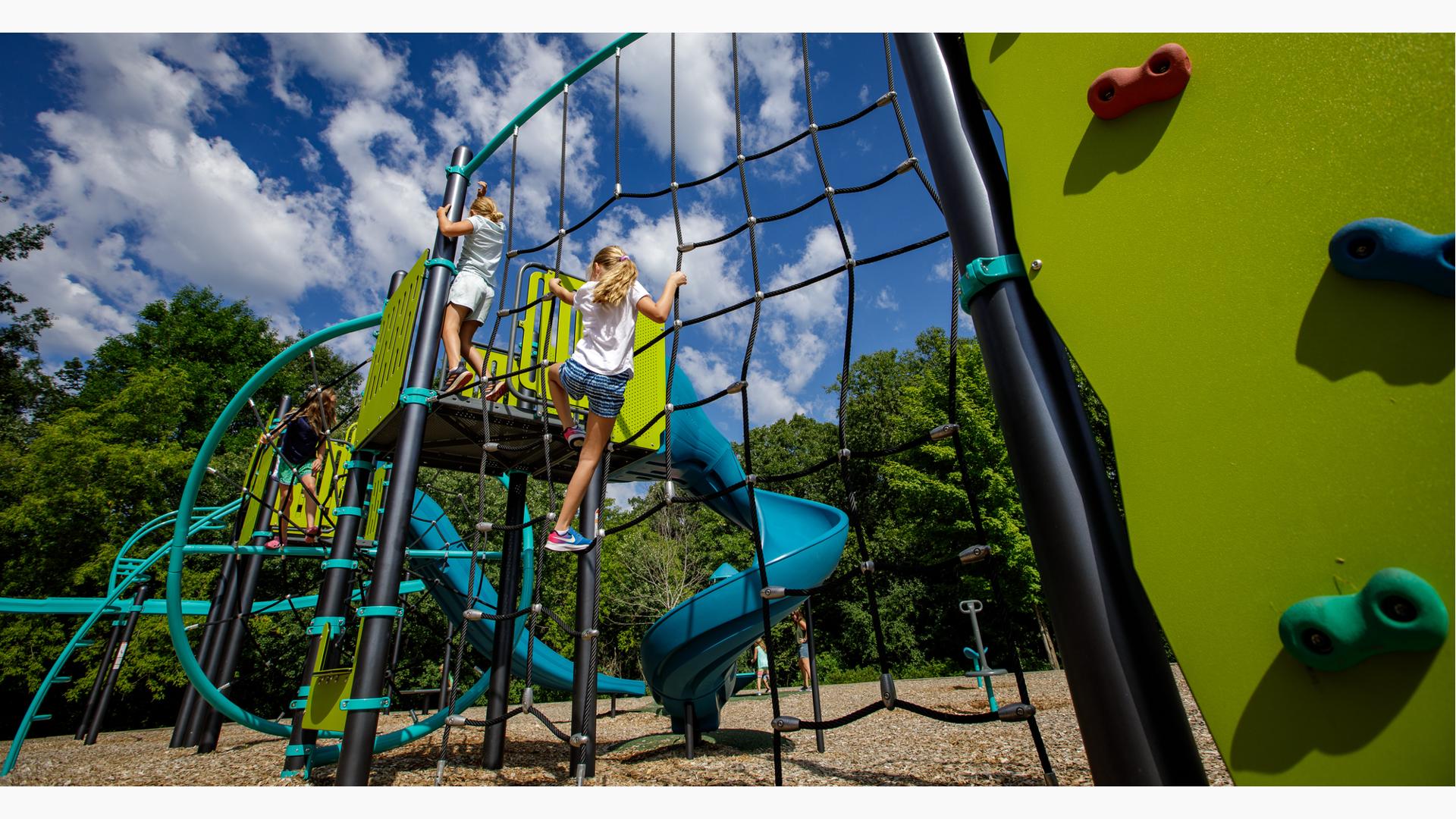 Kids going up climbing wall