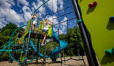 Kids going up climbing wall