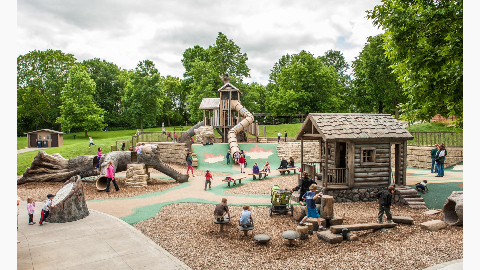 Lake Rebecca Park Reserve, Rockford, MN. A nature-inspired PlayBooster® with three unique levels features The giant split log, holes and other secret nooks and crannies.