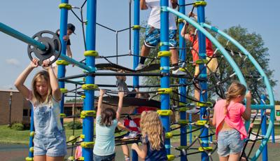 Kids using Netplex play structure