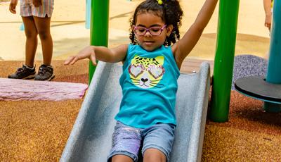 Girl riding slide