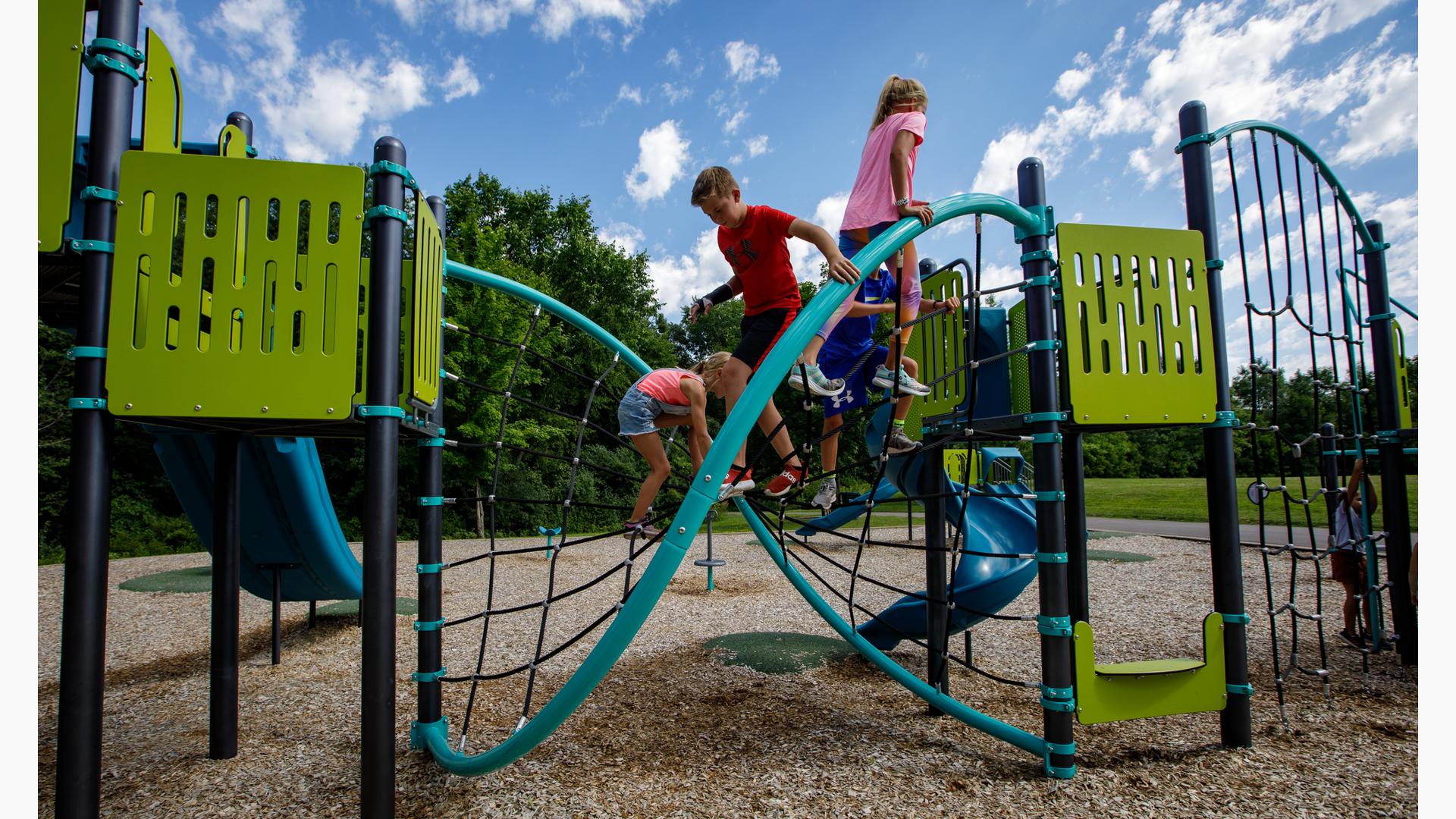 Children playing on the Flex Climber w/Permalene® Handholds