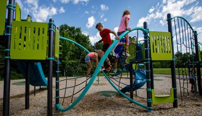 Children playing on the Flex Climber w/Permalene® Handholds