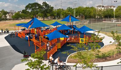 Metropolitan Multi Service Center Houston, TX. A brightly colored PlayBooster® play structure is connected by a series of ramps so all kids can access the many innovative inclusive and sensory activities. Such as the Sway Fun® glider, Sensory Play Center® and CoolToppers®.