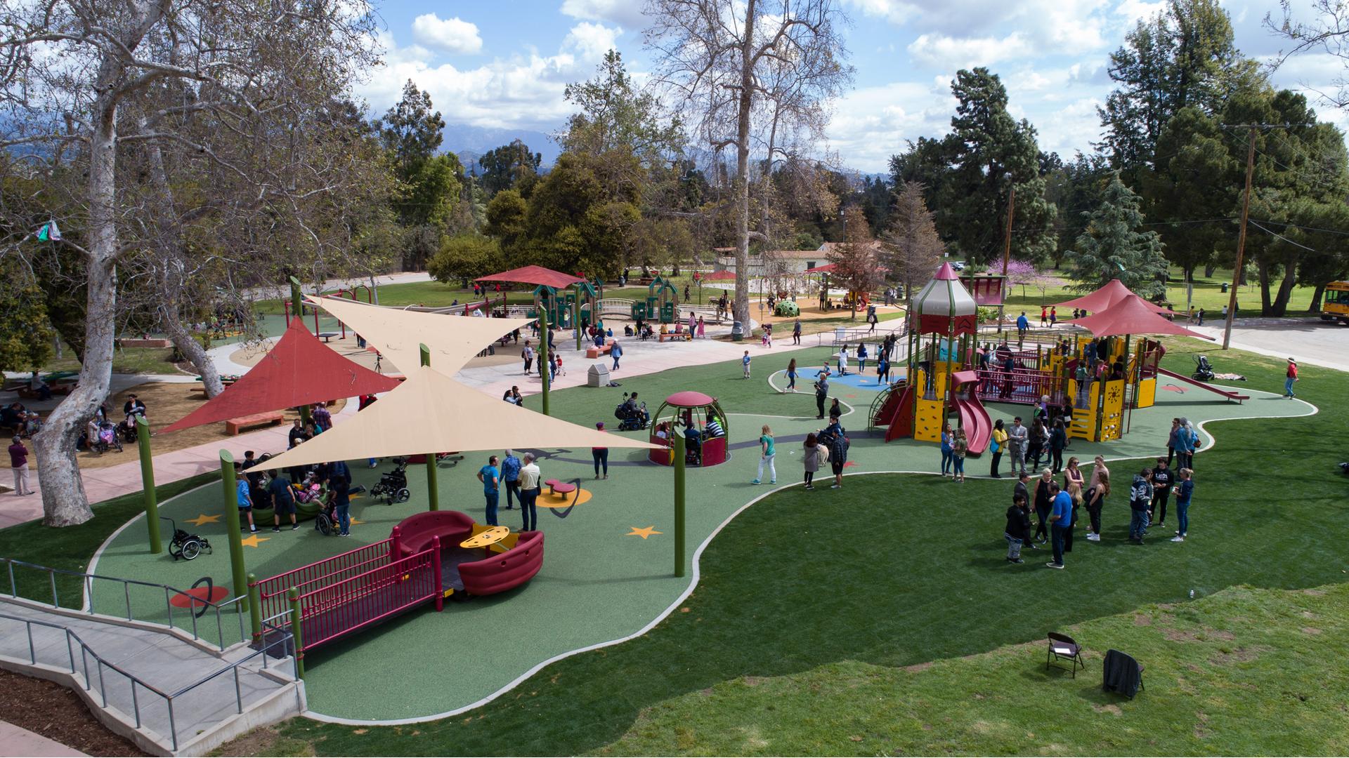  This playground celebrates the grand re-opening of the first Shane's Inspiration playground 20 years ago. Families with their kids celebrate by enjoying all the amenities of the park such as the many ramps, enclosures, learning wall panels, and many freestanding motion play elements such as the We-Go-Round and the Sway Fun.