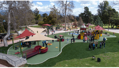  This playground celebrates the grand re-opening of the first Shane's Inspiration playground 20 years ago. Families with their kids celebrate by enjoying all the amenities of the park such as the many ramps, enclosures, learning wall panels, and many freestanding motion play elements such as the We-Go-Round and the Sway Fun.