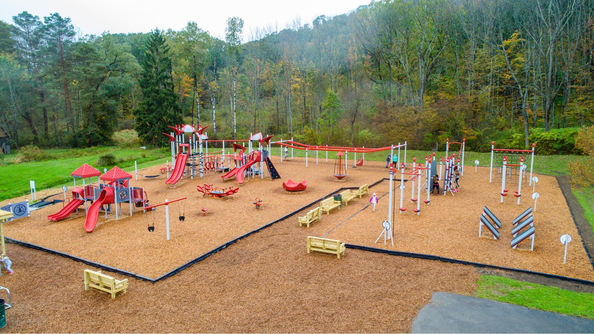 Surrounded by forest, Highland Ave Park is one part extreme fitness and one part imaginative play system.