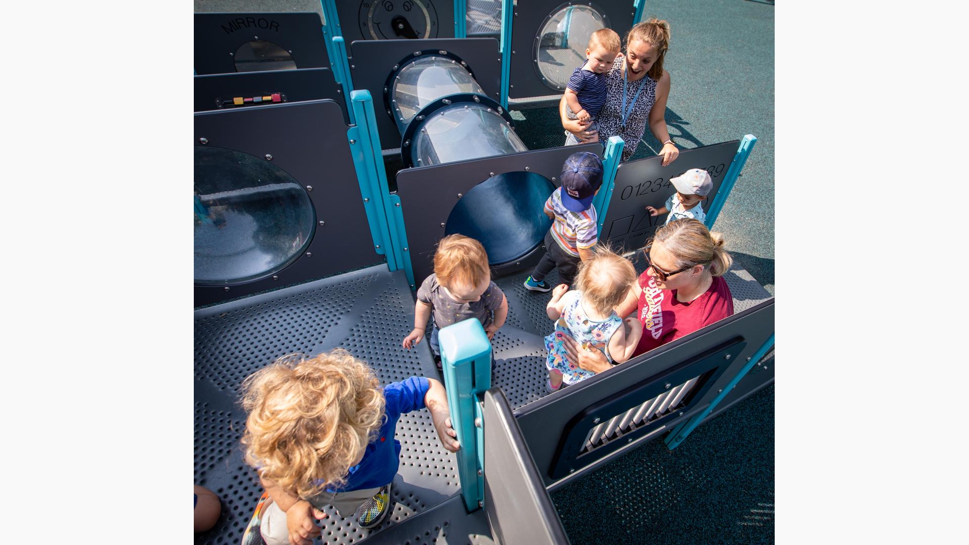 Children playing in tunnels and enclosures