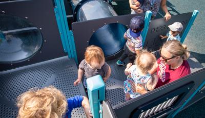 Children playing in tunnels and enclosures