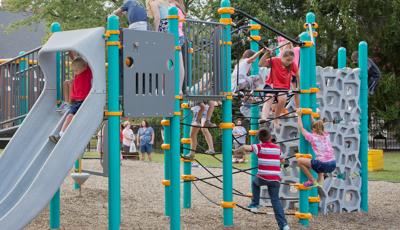 Kids climbing a Netplex climber