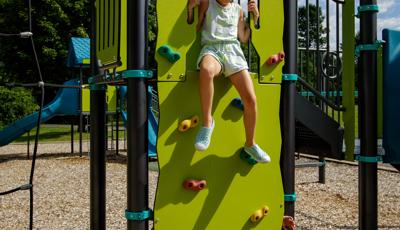Girl sitting on top of Vertical Ascent® Climber