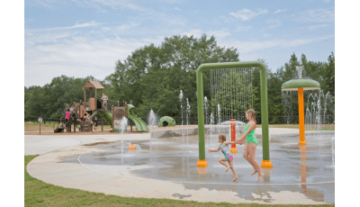 Nature Trail Splash Park and Playground Hamilton, AL. A PlayBooster® Tree House themed playground. Featuring the Discovery Tree Climb™, Log Steppers and DigiFuse® activity panels and much more. Along with a nearby Aquatix® splash pad.