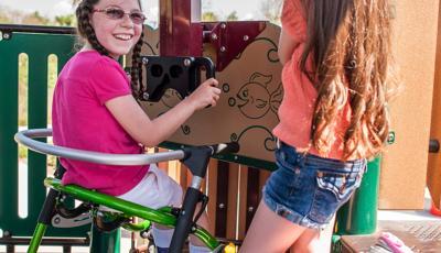 Two girls smiling on playground