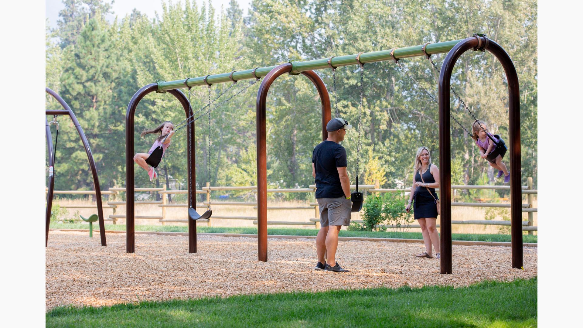 Families play on 5" Arch Swing Frame Additional Bay