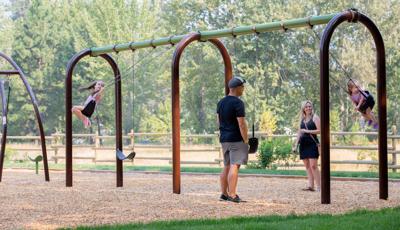 Families play on 5" Arch Swing Frame Additional Bay