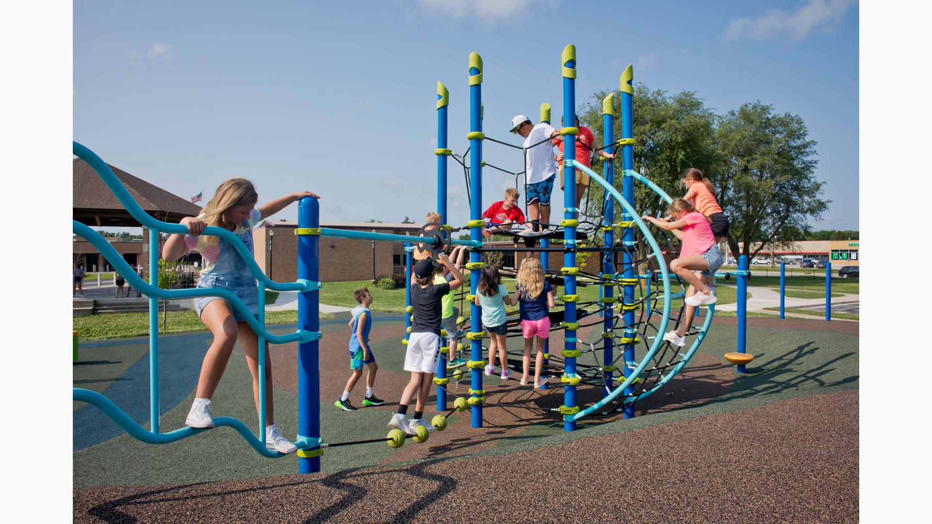 Girl on JigJag Climber w/Kids playing on Netplex® play structure