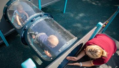 Child crawls through tunnel